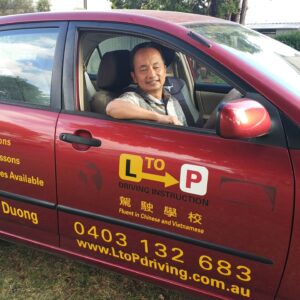 Sam, the driving instructor, in his car ready for a lesson at L to P Driving School in Toowoomba